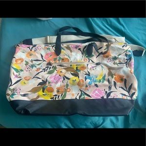 Floral and leather duffel bag